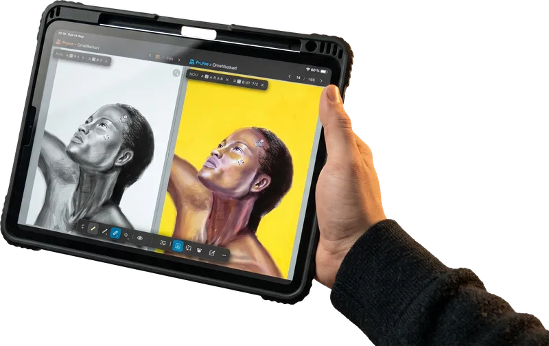 Tablet held in a hand, showing an app